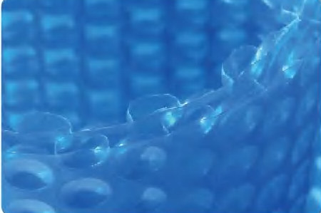 Close-up of blue solar pool cover bubble material